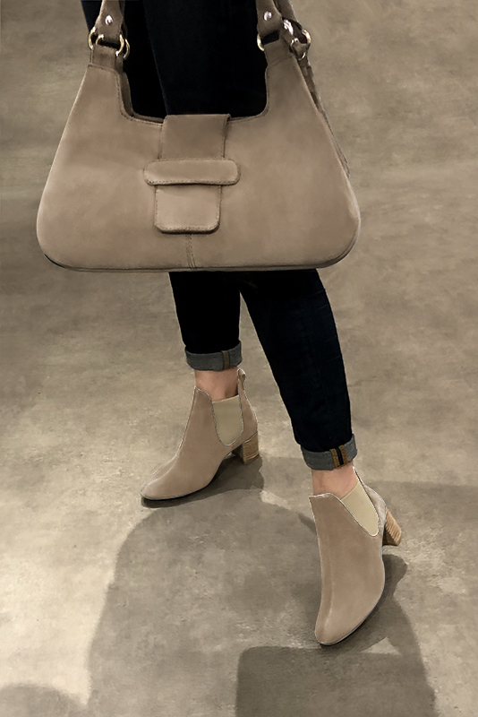 Tan beige and taupe brown women's ankle boots, with elastics. Round toe. Medium block heels. Worn view - Florence KOOIJMAN